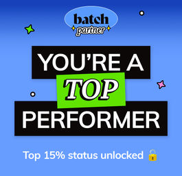 Bright blue achievement badge graphic reading “YOU’RE A TOP PERFORMER” with a green “TOP” banner, small stars and a padlock icon, captioned “Top 15% status unlocked” — digital recognition for top performer.