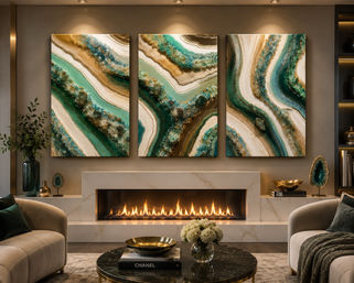 Modern luxury living room with a lit linear fireplace in a marble mantel, three-panel teal and gold geode abstract triptych above the hearth, beige sofas, black marble coffee table with white flowers, and decorative geode accents under warm ambient lighting.