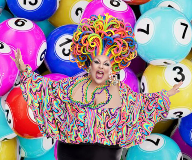 Vibrant drag performer wearing a rainbow curly wig, psychedelic swirl blouse, beads and star earrings, joyfully posing in front of colorful numbered lottery/bingo balls backdrop.