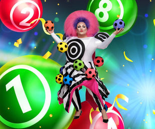 Vibrant lottery-themed scene with a drag performer in a bold pink afro and black-and-white target-striped outfit, surrounded by colorful polka-dot balls and large numbered lottery spheres (1, 2, 8), confetti and ribbons