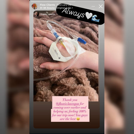 Cozy recovery: hand with an IV catheter and clear tubing taped to the back, resting on a plush brown blanket, shown as a social media story with stickers and a pink thank-you note.