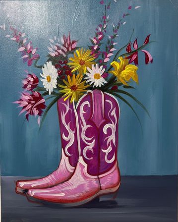 Playful painting of bright pink cowboy boots used as a vase for daisies, yellow lilies and mixed wildflowers against a teal background — colorful country/western decor.