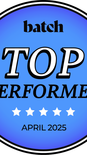 Blue circular award badge reading “TOP PERFORMER” with five white stars, “APRIL 2025” at the bottom and a small brand word at the top.