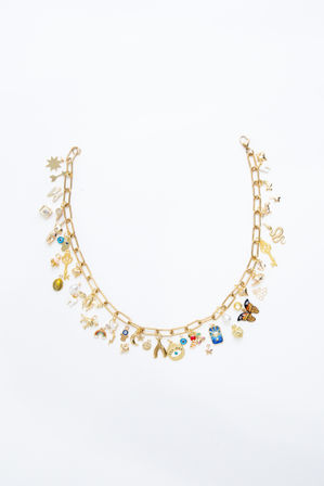 Gold chain charm necklace flat-lay on white background — fashion jewelry product shot with colorful enamel charms including butterfly, evil eye, key, wishbone, moon and stars.