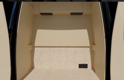 Empty beige van cargo area with carpeted floor, open rear doors framing the space and a small black access panel on the right wall.