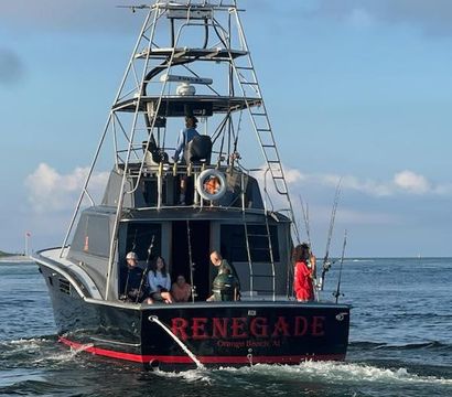 Rear view of a sportfishing boat with a tall observation tower, anglers and passengers on the stern holding multiple fishing rods, cruising in calm coastal waters under a clear blue sky.