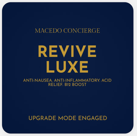 Sleek navy-and-gold wellness label featuring bold "REVIVE LUXE", smaller text listing benefits—anti-nausea, anti-inflammatory, acid relief, B12 boost—and the tagline "Upgrade Mode Engaged".