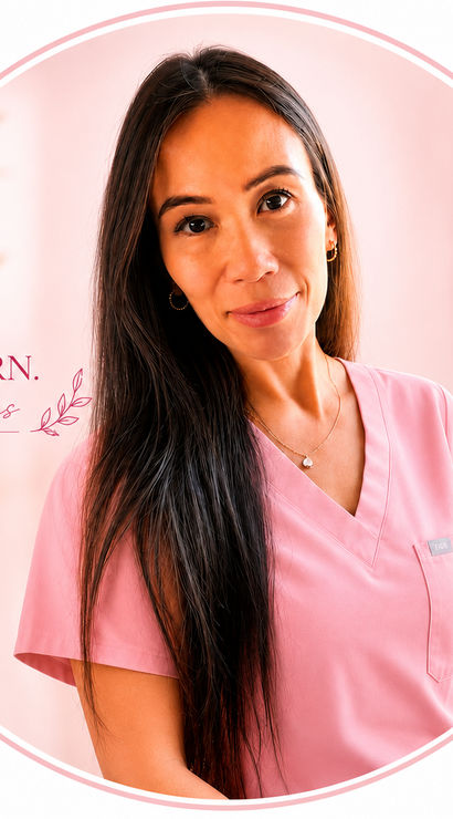 Warm portrait of a woman in pink medical scrubs smiling in a soft, pink-toned spa room, long dark hair, gold hoop earrings and delicate necklace, with blurred candles and a plant in the background — circular profile-style image.