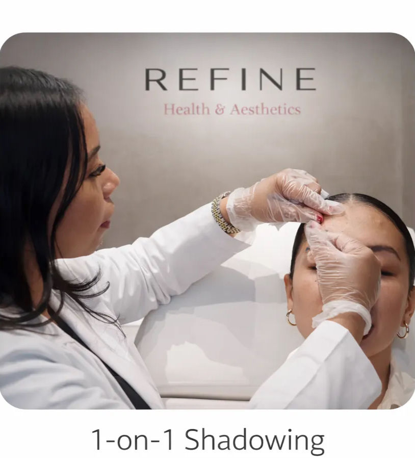 Skincare clinician wearing gloves performing a forehead treatment on a reclining client in an aesthetic clinic during a one-on-one shadowing/training session
