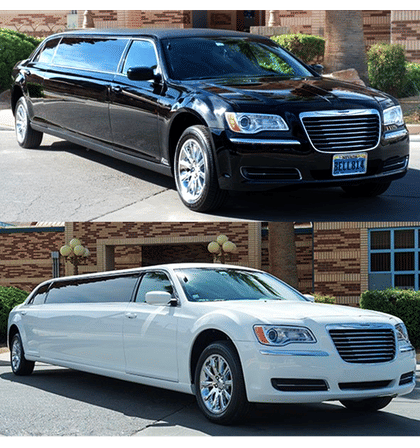Black and white stretch limousines parked outside a brick event venue with palm trees, glossy chrome wheels and tinted windows — luxury transportation for weddings and events