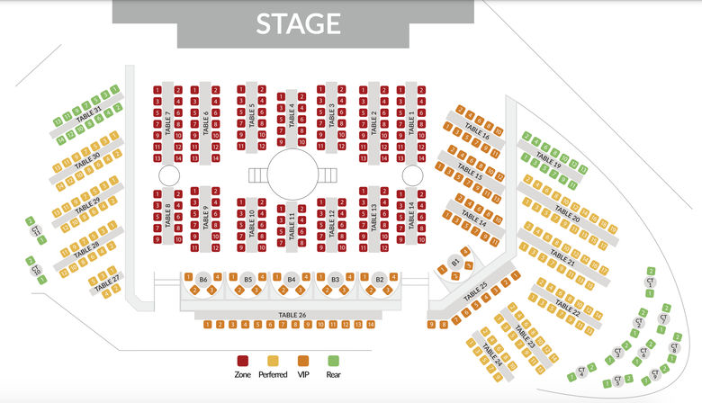 Top-down concert venue seating chart floor plan showing STAGE at top, numbered central red seating zone, surrounding yellow preferred sections, orange VIP tables near front, green rear seats, table numbers and legend
