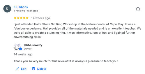 Screenshot of a 5-star Google review praising a stone-set ring workshop at a nature center in Cape May, noting hands-on silversmithing skills and a brief business reply.