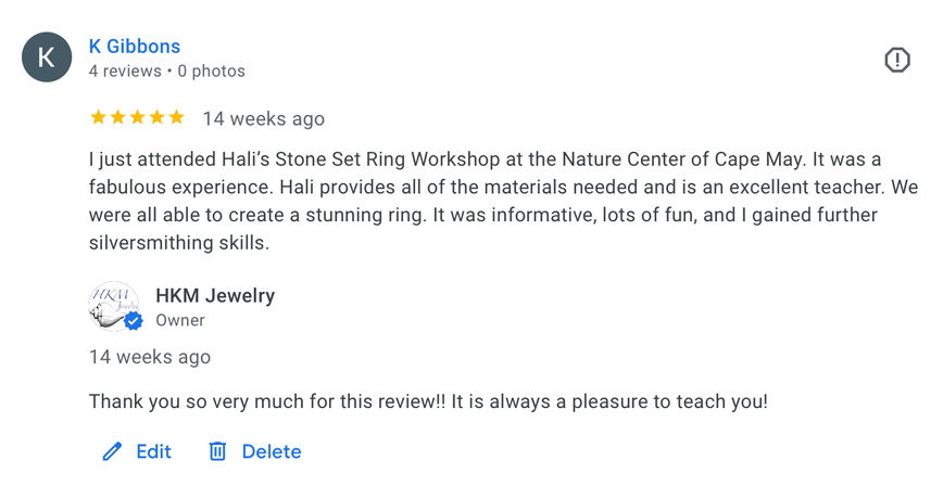 Screenshot of a 5-star Google review praising a stone-set ring workshop at a nature center in Cape May, noting hands-on silversmithing skills and a brief business reply.
