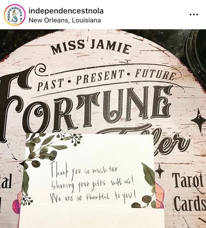 Handwritten thank-you note with watercolor leaves placed on a round vintage 'Fortune' tarot sign reading 'Past · Present · Future' — New Orleans, Louisiana