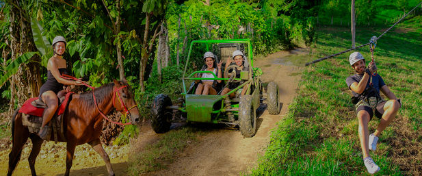 Tropical jungle adventure scene with people enjoying activities: a woman on horseback, two riders in a green off-road buggy on a dirt trail, and a man zooming on a zipline above a grassy hillside — helmets on for safety.