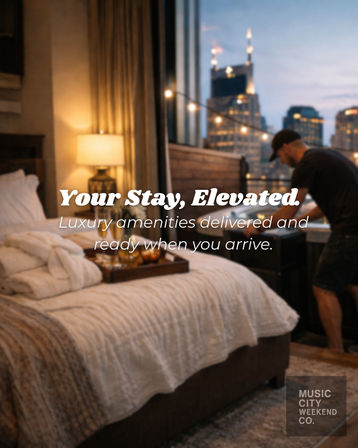 Cozy downtown suite at dusk with a made bed, plush robe and breakfast tray, warm bedside lamp, balcony string lights and a delivery worker setting up against a city skyline.