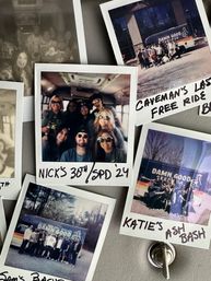 Collage of Polaroid instant photos on a gray board featuring groups of smiling friends inside a party van and outdoors by a colorful tour van, handwritten captions and a metal hook