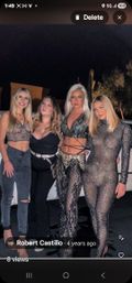 Four women posing for a night-out group photo in a parking lot, wearing glam clubwear—sparkly sheer bodysuit, lace crop top, black corset top, and patterned wrap pants—standing by a white vehicle.