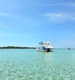 Crab Island Pontoon Party with Three Slides, Paddleboards, Lily Pad + Cooler image 10